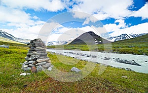 A beautiful summer landscape of mountain river in Sarek National Park, Sweden.