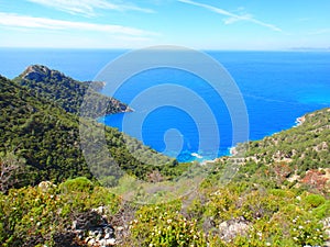 Beautiful Summer Landscape: mountains, blue sea, green trees.