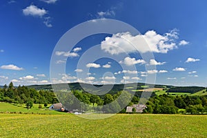 Beautiful summer landscape with nature. Meadow with forest and blue sky on a sunny day. Highlands - Czech Republic