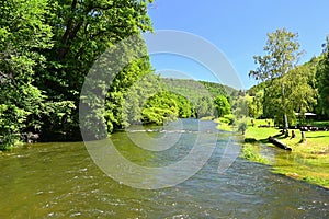 Beautiful summer landscape with river, forest, sun and blue skies. Natural colorful background. Jihlava River, Czech Republic -