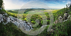 Beautiful summer landscape at sunset with forest. Village near town of Nitra, Slovakia