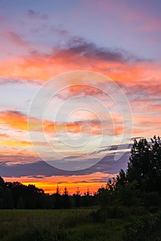 Beautiful summer landscape. Sunset sky with clouds.