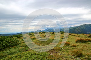 Beautiful summer mountain landscape with dramatic sky and clouds in the background