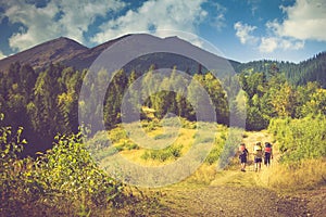 Beautiful summer mountain landscape.Tourists with backpacks climb to the top of the mountain.