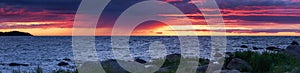 Beautiful summer seascape panorama during drammatic sunset.