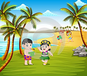 The beautiful summer season in the beach with the children using the hawaii costume