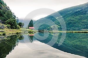 Beautiful summer view of Sognefjorden fjord. Green morning scene of Flom port, Norway. Beauty of nature concept background.