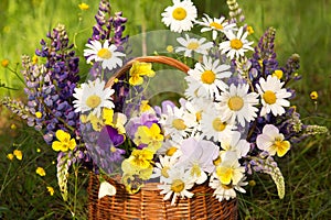 Beautiful summer wedding white yellow blue violet purple bouquet, flowers arrangement in basket by florist