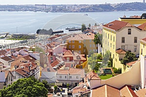 Sun-lit panorama of the red-tiled Lisbon roofs photo