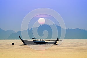 beautiful sun rising sky with domestic fishery boat at koh payam island andaman sea ranong southern of thailand