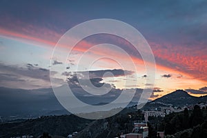 A beautiful sunet over the famous volcano etna close to Taormina in Sicily, Italy