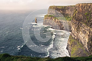 Beautiful sunlight on amazing landforms on Cliffs of Moher, Ireland photo