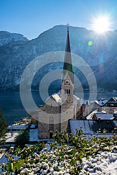 beautiful sunny cityscape of the special city Hallstatt in Austria Salzkammergut snowy winter mountains and lake and