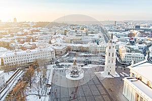 Beautiful sunny Vilnius city scene in winter. Christmas tree on the Cathedral square. Aerial early evening view. Winter scenery in