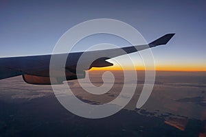 Beautiful sunrise with aircraft wing during View from windows aircraft