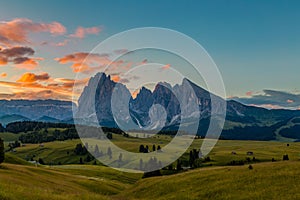 Beautiful sunrise at Alpe di siusi with langkofel mountain in Dolomites, Italy