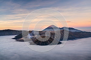 Beautiful sunrise at Bromo volcano mountain in East Java, Indonesia surrounded by morning fog