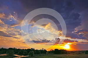 Beautiful sunrise and dramatic clouds on the sky. photo