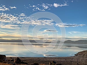 Beautiful sunrise on empty lake with beach