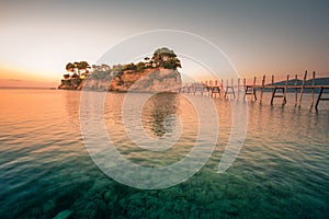 Beautiful sunrise at the famous Cameo island. A beautiful small island with wooden bridge and turquoise water. Zakynthos