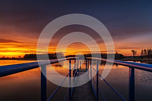 A beautiful sunrise on the lake shore in eastern Poland and a wonderful sky full of colors