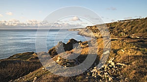 Beautiful sunrise landscape image of Church Ope Cove in Portland