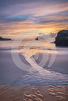 Beautiful sunrise landsdcape of idyllic Broadhaven Bay beach on