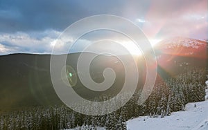 Beautiful sunrise in the mountains in winter. Carpathian mountains, Ukraine, Europe.