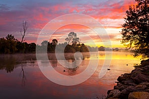 Beautiful sunrise over the billabong with a light ground fog