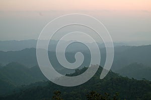 Beautiful sunrise over mountain range view from wooden terrace