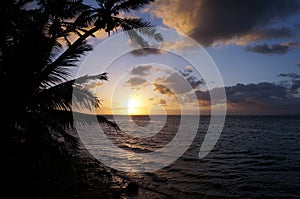 Beautiful Sunrise over the ocean with waves moving to rocky Beach on the Molokai