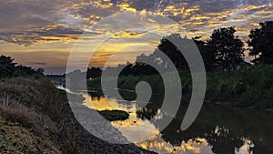 Beautiful sunrise reflection in a canal