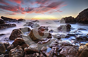 Beautiful sunrise on rocky shore