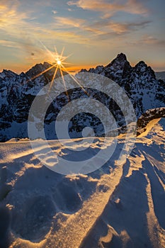 Beautiful sunrise from Rysy peak during winter golden hour photo