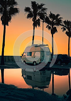 Beautiful sunrise scene with white small camping van