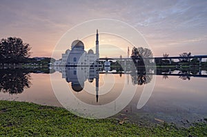 Beautiful sunrise scenery of As-Salam Mosque located in Selangor, Malaysia with reflecton on the lake