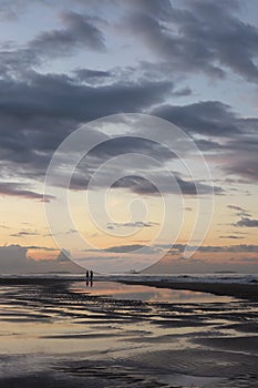 Beautiful sunrise sea beach with dramatic clouds and sky