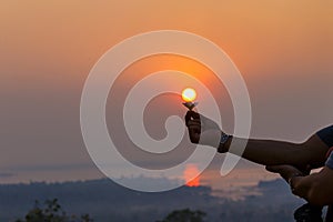 Beautiful sunrise,Silhouette peple with in sunrise, Thailand.