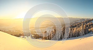 Beautiful Sunrise in snow mountains landscape. Amazing yellow Sunshine. Allgau, Mittag Mountain, Bavaria, Alps, Germany.