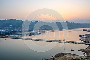 Beautiful sunrise At songgaria river in Sangkhla Buri kanchanaburi thailand