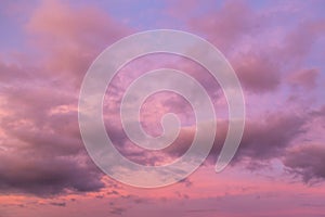 Beautiful sunrise, sunset purple pink violet blue sky with clouds abstract background texture