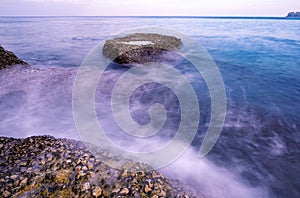 Beautiful sunrise or sunset seascape scenery over tropical sea in Phuket Thailand Epic dawn sea landscape with rocks in the