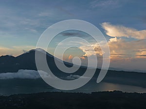 Beautiful sunrise on the volcano. View of Agung volcano from the peak of Batur. Indonesia, Bali.
