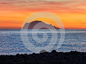 Beautiful sunrise withe the Panarea island seen from the Salina island in the Aeolian islands, Sicily, Italy