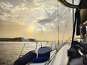 Beautiful sunset from aboard a luxury yacht sailing off the coast in the Mediterranean