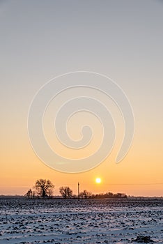 Beautiful sunset above snowy field in village KisaÄ, Vojvodina, Serbia