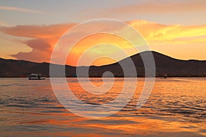 Beautiful Sunset Afterglow Reflecting on Lake Titicaca, the World`s Highest Navigable Lake in Puno, Peru