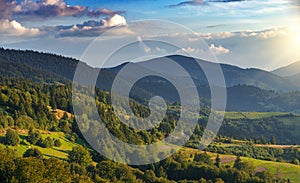 Beautiful sunset on the background of the mountain landscape.