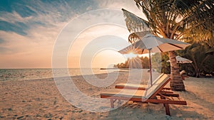 Beautiful sunset beach. Chairs on the sandy beach near the sea. Summer holiday and vacation concept. Inspirational tropical scene.