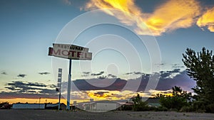 Beautiful sunset behind Restaurant Motel sign